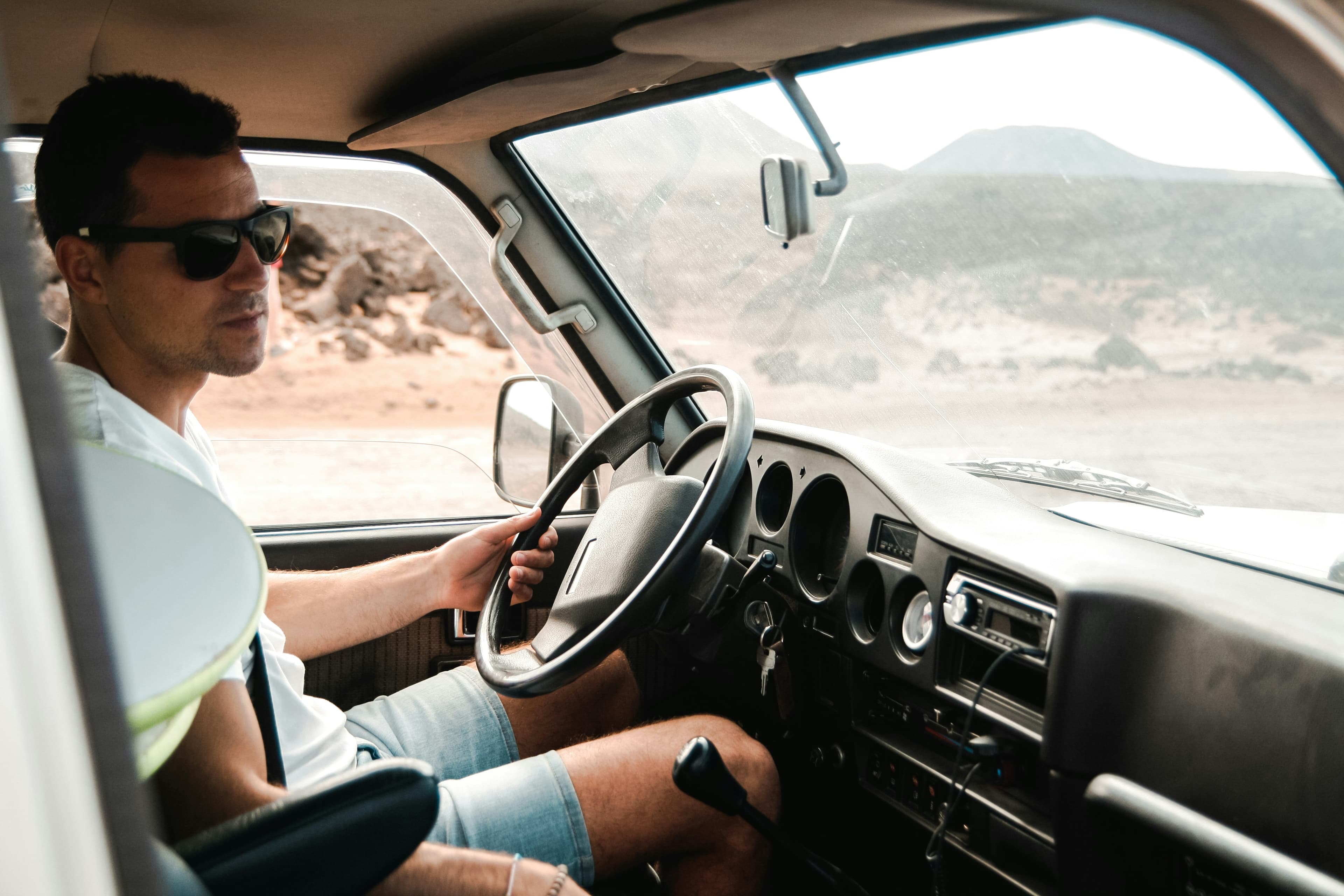 Driver's hands on the steering wheel