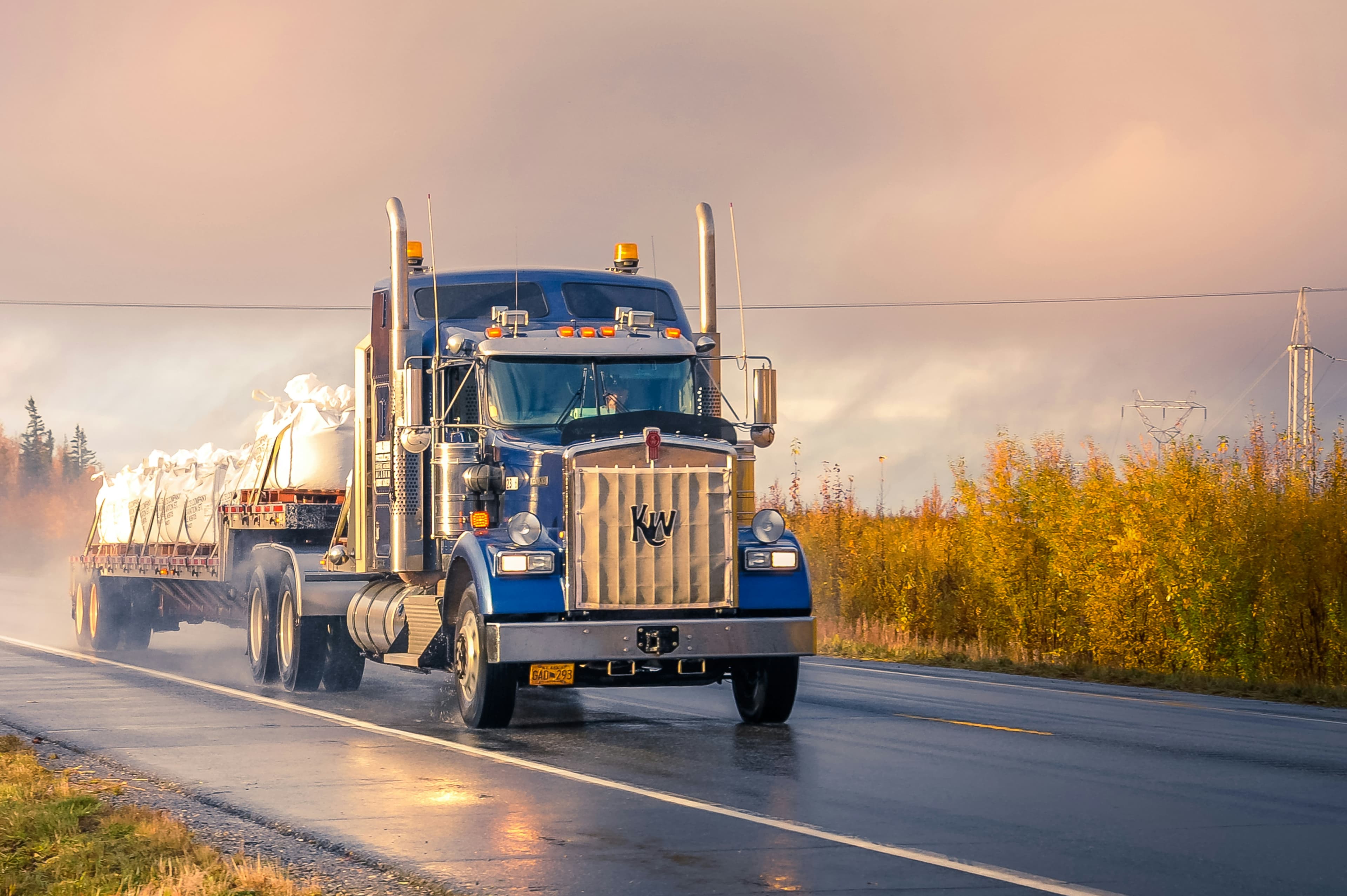 Long-nose semi truck on an open highway